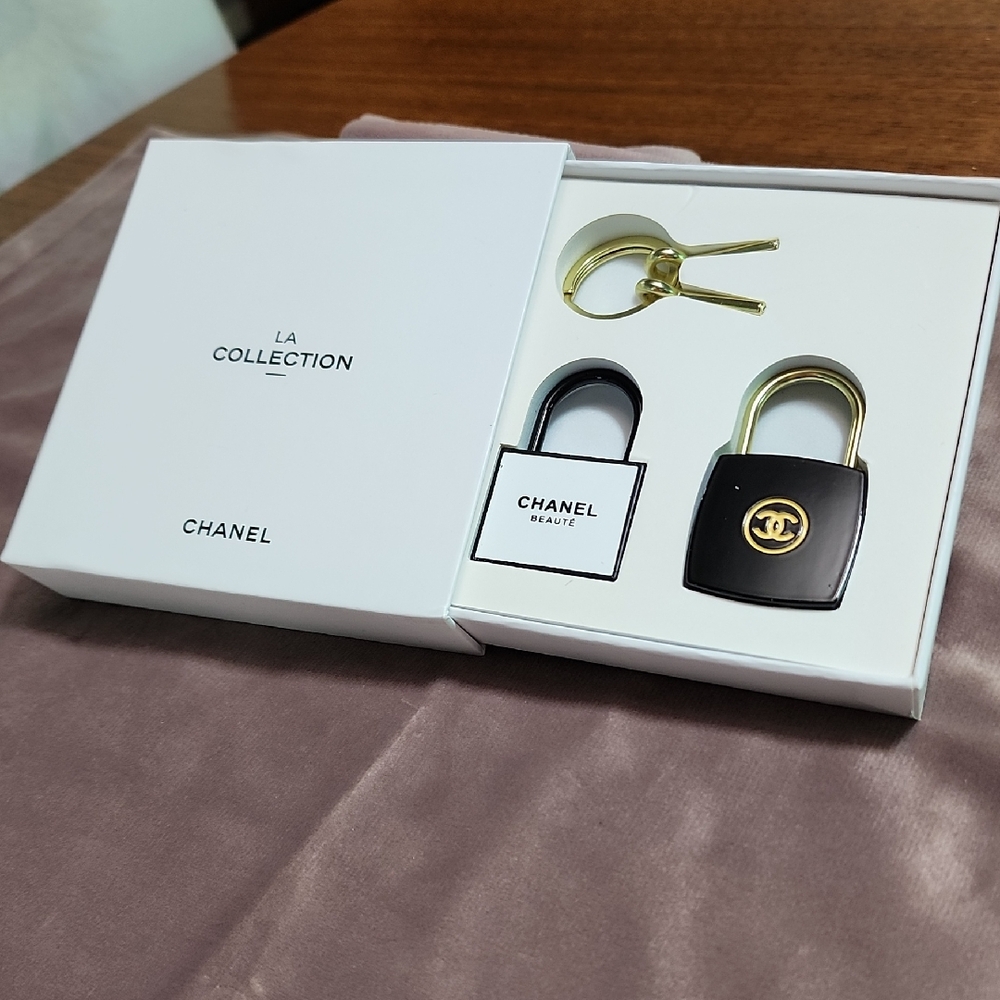 CHANEL Black and Gold Padlock Duo
